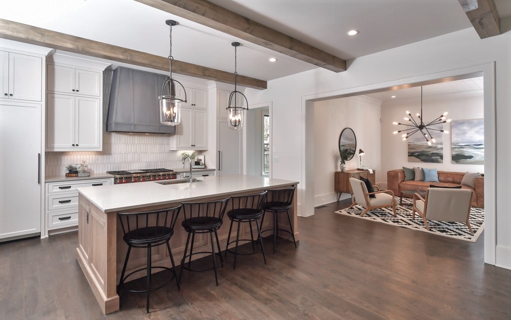 Open concept kitchen with eat-up island and range hood